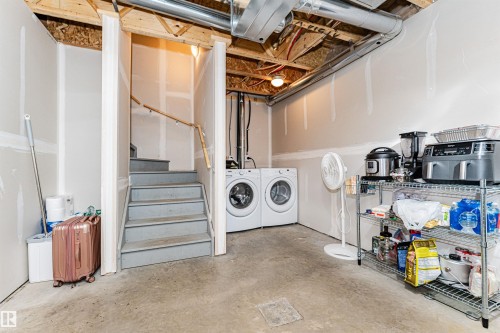 Unfinished basement space featuring a concrete floor, exposed ceiling joists, and drywall-ready walls - 31 4029 Orchards Drive, Edmonton, AB 