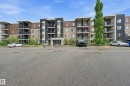 Multi-story building featuring a brick and stone facade with multiple balconies - 304 11804 22 Avenue, Edmonton, AB 