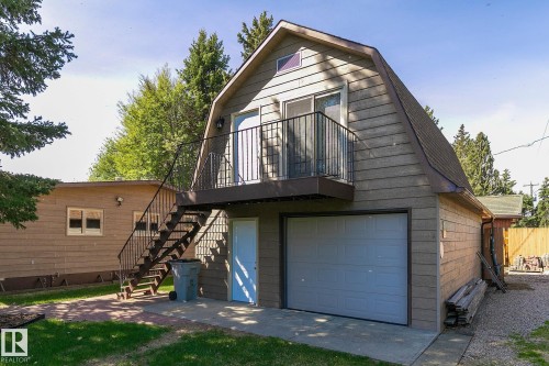 Oversized single garage with sleeping quarters & 3 piece bath above - 98 Argentia Beach, Rural Wetaskiwin County, AB - Outdoor