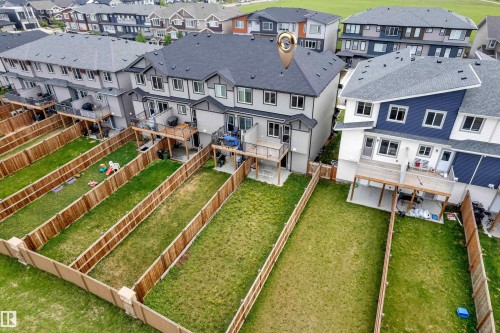 Rear exterior featuring a private yard with a wood fence - 1534 157 Street, Edmonton, AB 