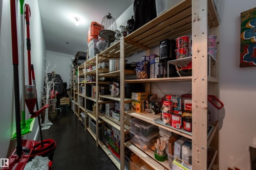 Expansive storage area featuring multiple wooden shelving units - 14508 78 Avenue, Edmonton, AB 