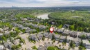 Aerial perspective showcasing the residential neighborhood with a river and natural landscape - 116 Darlington Crescent, Edmonton, AB 