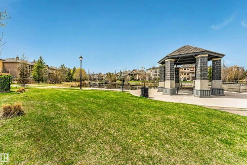 Community gazebo featuring a wood-shingle roof and stone pillars - 116 Darlington Crescent, Edmonton, AB 