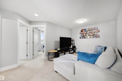 Carpeted room featuring light gray walls, white trim, and recessed lighting - 