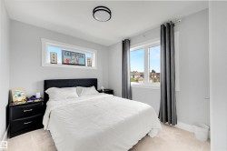 Neutral wall color with two windows, including a transom window - 