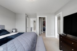 Carpeted room featuring light gray wall paint, white trim, and recessed lighting - 