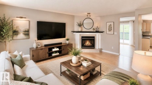 Living area featuring light wood-finish flooring, a corner fireplace with a white mantel, and neutral wall tones - 9 225 Blackburn Drive E, Edmonton, AB 