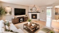 Living area featuring light wood-finish flooring, a corner fireplace with a white mantel, and neutral wall tones - 