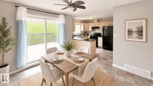 Dining area featuring a sliding glass door to an outdoor deck and a ceiling fan - 9 225 Blackburn Drive E, Edmonton, AB 