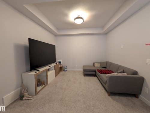 Recessed ceiling detail and light gray wall paint enhance this room - 9240 224 Street Nw, Edmonton, AB - Indoor Photo Showing Other Room