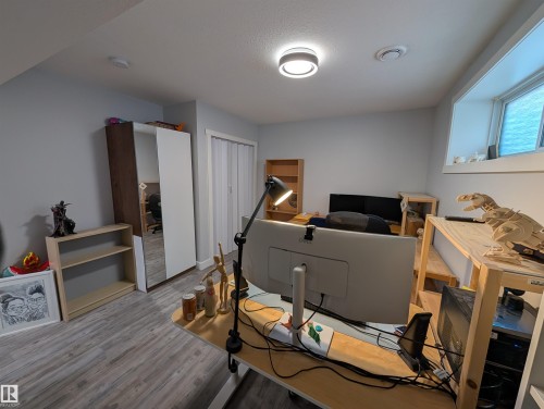 Recessed lighting, light gray walls, and wood-finish flooring - 9240 224 Street Nw, Edmonton, AB - Indoor Photo Showing Other Room