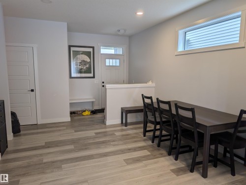 Expansive open-concept space featuring wood-finish flooring throughout - 9240 224 Street Nw, Edmonton, AB - Indoor