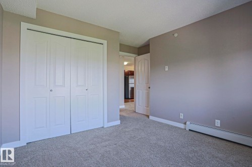 Neutral tone wall paint with white trim accents - 405 11804 22 Avenue Sw, Edmonton, AB 