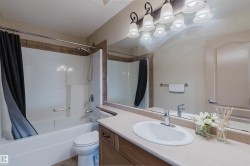 Full bathroom featuring a single vanity, integrated sink, and a combination shower/tub - 
