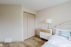 Neutral-toned walls complement wood-finish flooring - 