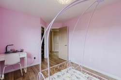 Hardwood-finish flooring extending into the hallway - 