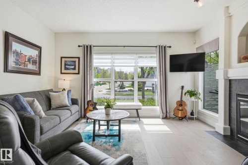 204 Sheppard Court, Edmonton, AB - Indoor Photo Showing Living Room With Fireplace