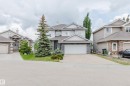 Contemporary two-story residence featuring a combination of stone veneer and stucco siding - 20524 58 Avenue, Edmonton, AB 