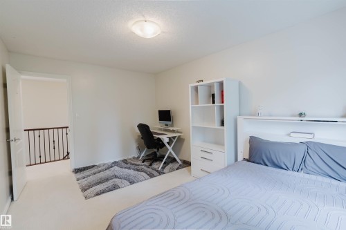 Neutral white walls complement light-colored carpeting - 20524 58 Avenue, Edmonton, AB 