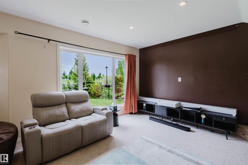 Room featuring a brown accent wall and recessed lighting - 20524 58 Avenue, Edmonton, AB 