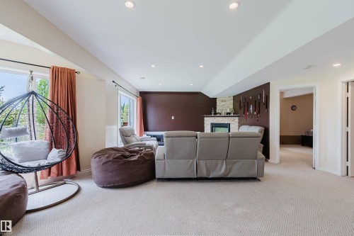 Spacious room featuring light-toned carpeting and recessed lighting - 20524 58 Avenue, Edmonton, AB 