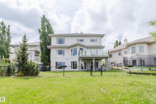 Property rear elevation featuring a two-story design with a stucco exterior - 20524 58 Avenue, Edmonton, AB 
