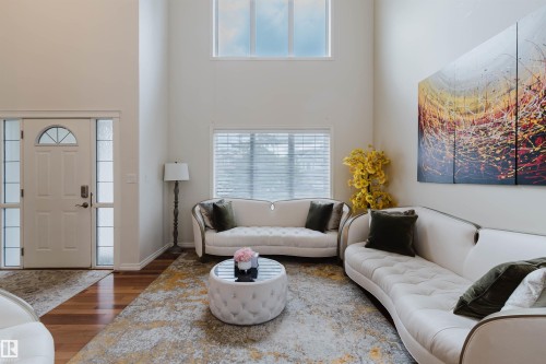Two-story living area with high ceilings and wood-finish flooring - 20524 58 Avenue, Edmonton, AB 