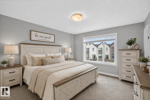 Bedroom with light gray walls and carpeted flooring - 90 1010 Rabbitt Hill Road Sw, Edmonton, AB - Indoor Photo Showing Bedroom