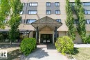 Multi-story building featuring a prominent entrance canopy with "River Valley Condominiums" signage - 901 9710 105 Street, Edmonton, AB  - Outdoor With Facade 