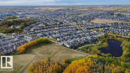 Aerial view of a developed residential area featuring a variety of properties, green spaces, and bodies of water - 320 Secord Boulevard, Edmonton, AB - Outdoor With View