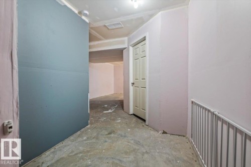 Partially finished basement with open space, furnace room, and one bathroom. - 17703 65 Street Nw, Edmonton, AB 