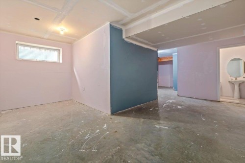 Partially finished basement with open space, furnace room, and one bathroom. - 17703 65 Street Nw, Edmonton, AB 
