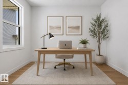 Bright room featuring a large window, light wood-finish flooring, white baseboards, and a neutral color palette - 