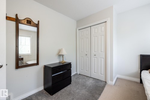 White paneled bi-fold closet doors feature prominent hardware - 2036 Towne Centre Boulevard, Edmonton, AB - Indoor
