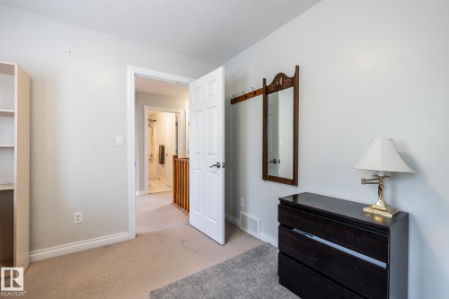 Neutral wall paint, light-toned carpeting, and white trim - 2036 Towne Centre Boulevard, Edmonton, AB - Indoor Photo Showing Other Room