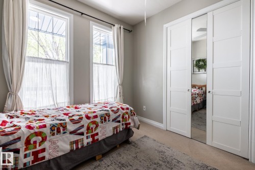 Recessed windows with natural light, featuring a built-in closet with mirrored bi-fold doors - 2036 Towne Centre Boulevard, Edmonton, AB - Indoor Photo Showing Bedroom