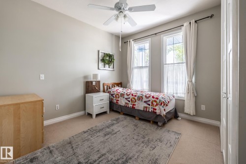 Light gray wall paint complemented by white trim - 2036 Towne Centre Boulevard, Edmonton, AB - Indoor Photo Showing Bedroom
