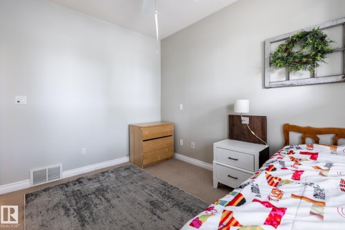 Neutral wall paint with carpet flooring, complemented by white baseboards - 2036 Towne Centre Boulevard, Edmonton, AB - Indoor Photo Showing Bedroom