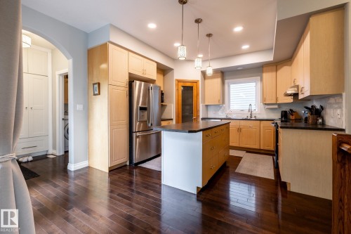 Kitchen featuring dark wood-finish flooring and light wood cabinetry - 2036 Towne Centre Boulevard, Edmonton, AB - Indoor Photo Showing Kitchen