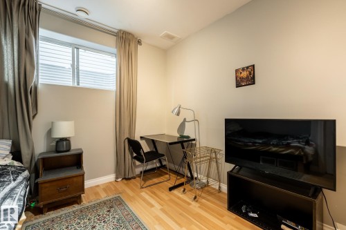 Light wood-finish flooring complements neutral wall tones - 2036 Towne Centre Boulevard, Edmonton, AB - Indoor