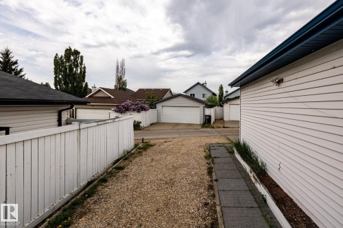 Detached garage featuring horizontal siding and blue trim - 2036 Towne Centre Boulevard, Edmonton, AB - Outdoor With Exterior