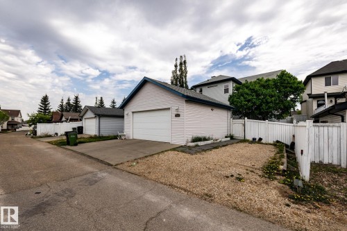 Detached garage with white siding and a blue-trimmed roof - 2036 Towne Centre Boulevard, Edmonton, AB - Outdoor
