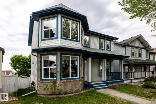 Two-story residence featuring light-colored siding with dark trim accents - 2036 Towne Centre Boulevard, Edmonton, AB - Outdoor With Facade