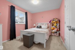 Carpeted room with a ceiling-mounted light fixture - 