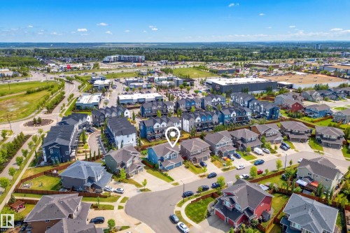 Aerial overview of a residential area featuring single-family homes and townhomes - 70 James Crescent, St. Albert, AB 
