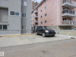 Concrete parking area with painted space lines - 