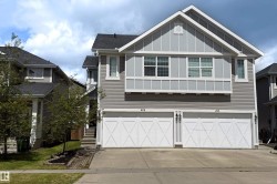 Contemporary gray siding exterior with white trim accents and a prominent front-facing gable - 