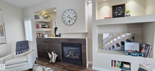 Gas fireplace with a dark tile surround and hearth - 4234 46 Street, Vegreville, AB - Indoor With Fireplace
