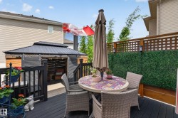 Spacious outdoor deck with dark wood-finish flooring - 