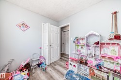 Light gray wall paint complemented by wood-finish flooring - 